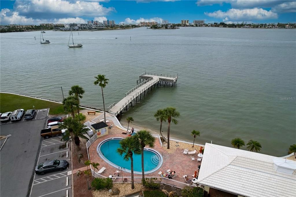 4650 Cove Circle, Unit 209 St. Petersburg, FL 33708 - Photo 38 of 54 a terrace with outdoor seating and city view