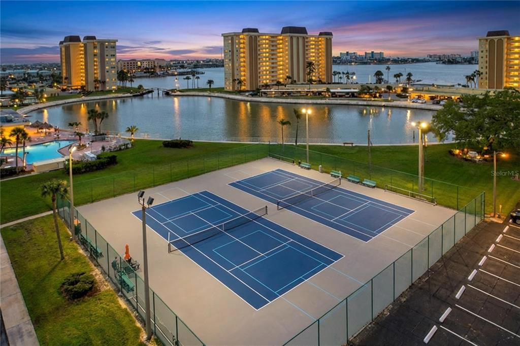 4650 Cove Circle, Unit 209 St. Petersburg, FL 33708 - Photo 40 of 54 a view of a city with an ocean