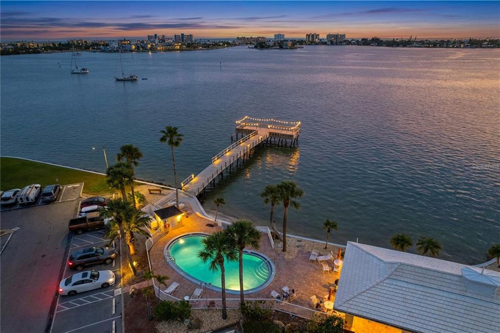 4650 Cove Circle, Unit 209 St. Petersburg, FL 33708 - Photo 53 of 54 an aerial view of a house with a lake view