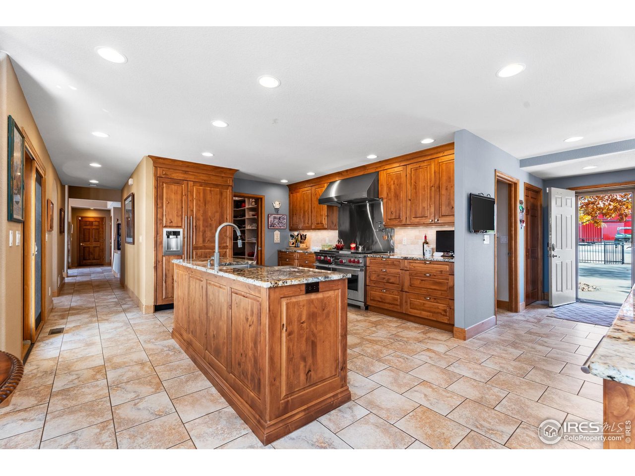 12625 Vermillion Road Longmont, CO 80504 - Photo 18 of 50 a kitchen with stainless steel appliances granite countertop a refrigerator and a stove