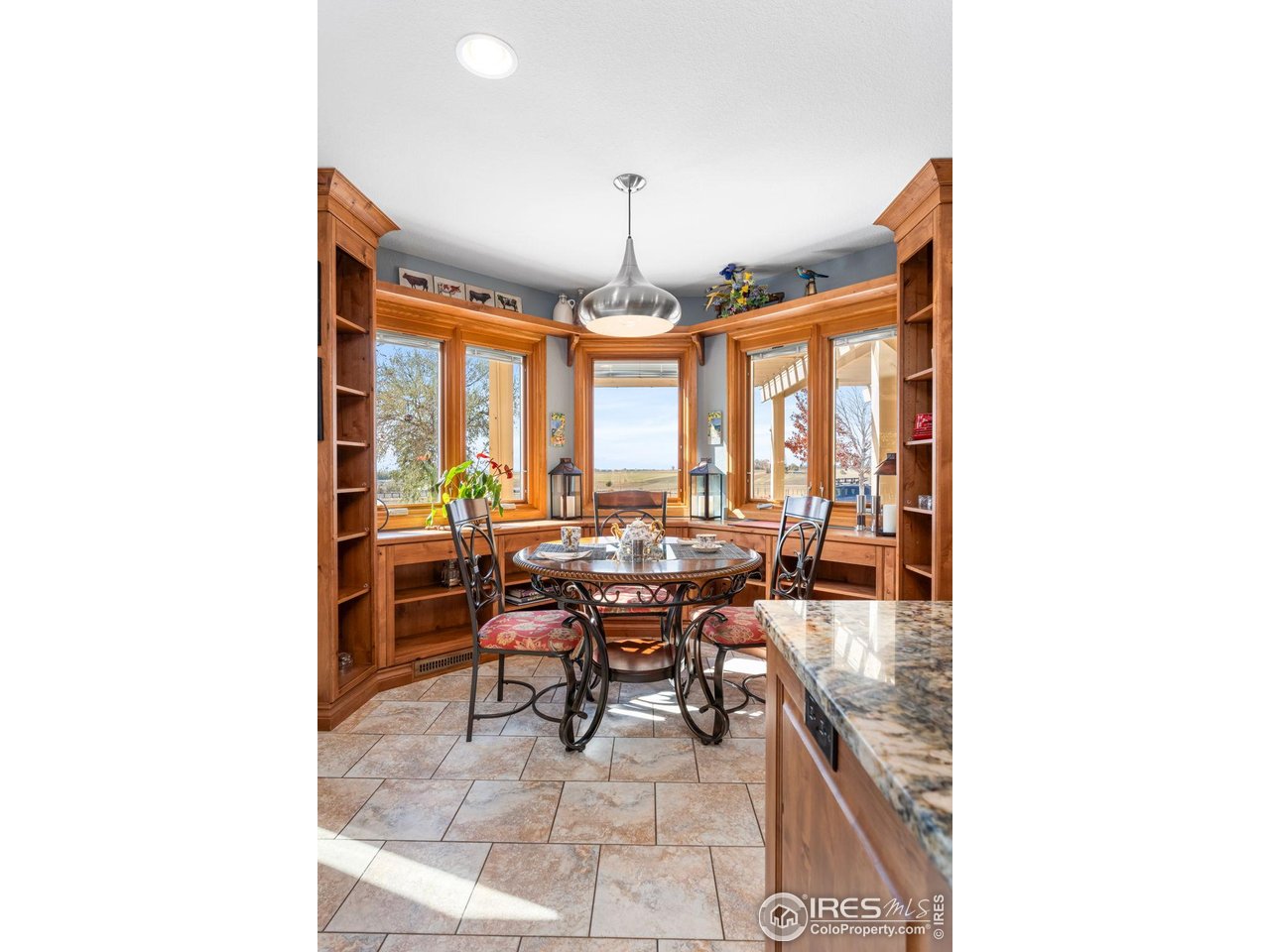 12625 Vermillion Road Longmont, CO 80504 - Photo 20 of 50 a dining room with furniture and a large window