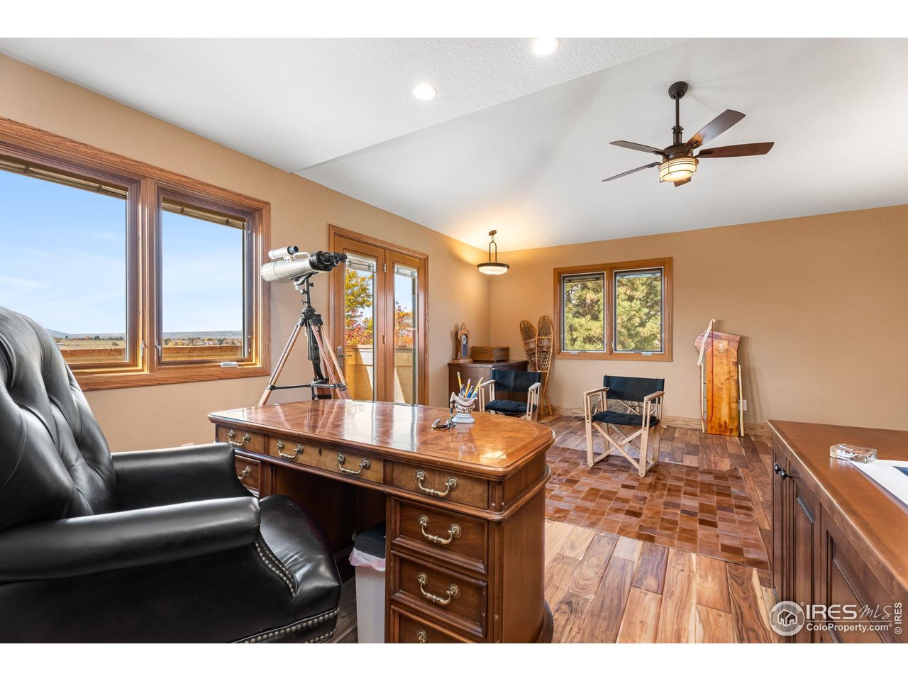 12625 Vermillion Road Longmont, CO 80504 - Photo 32 of 50 a room with a table chairs and a kitchen view