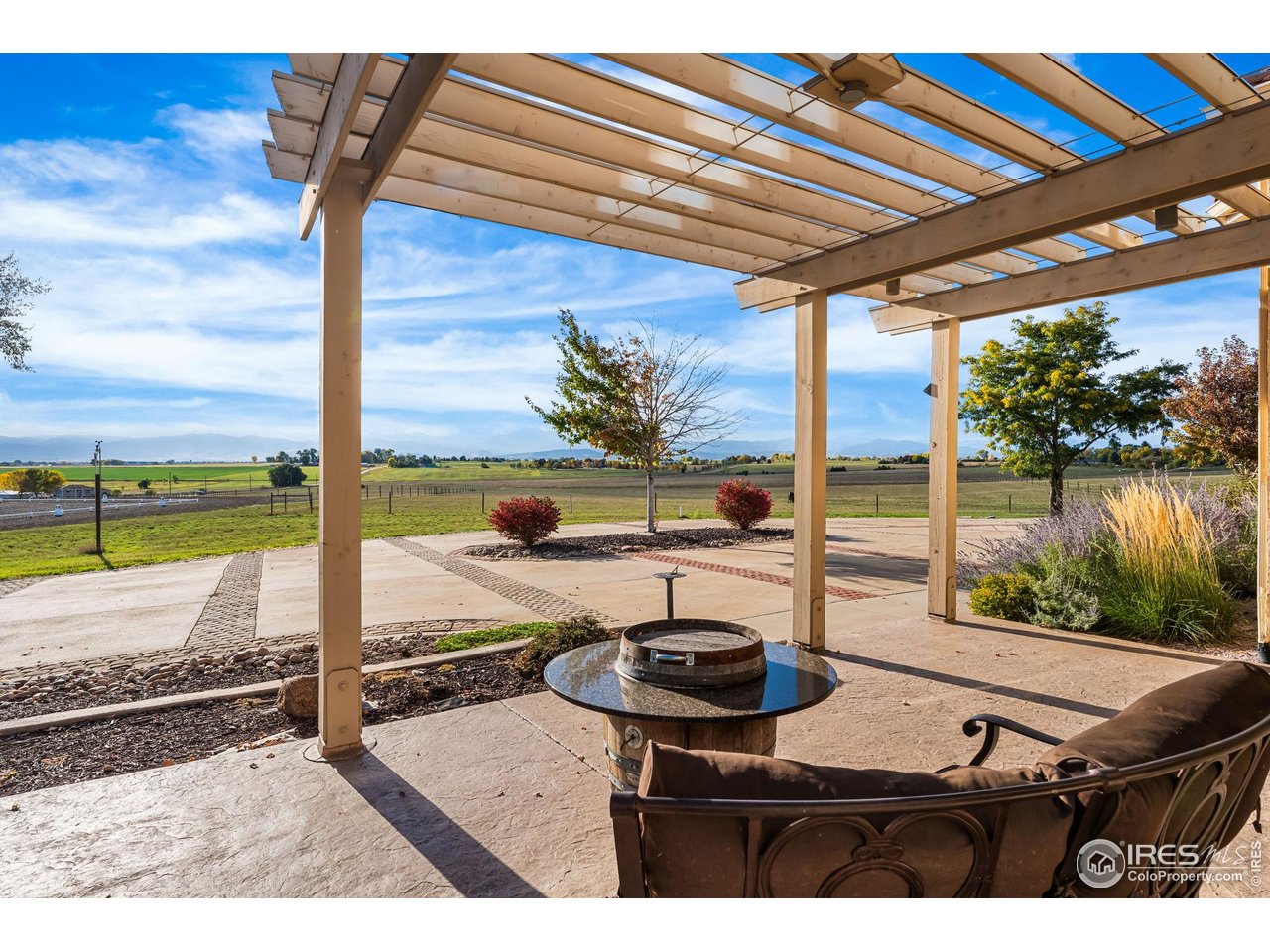 12625 Vermillion Road Longmont, CO 80504 - Photo 43 of 50 a view of a patio with a table chairs and a patio