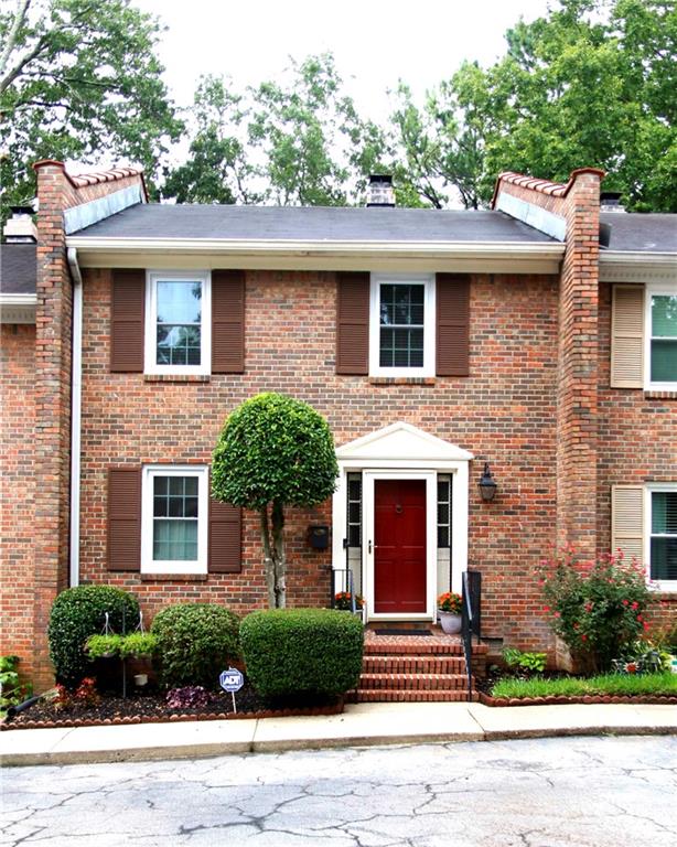 114 Glen Acres Court Decatur, GA 30035 - Photo 1 of 1 a front view of a house with a garden