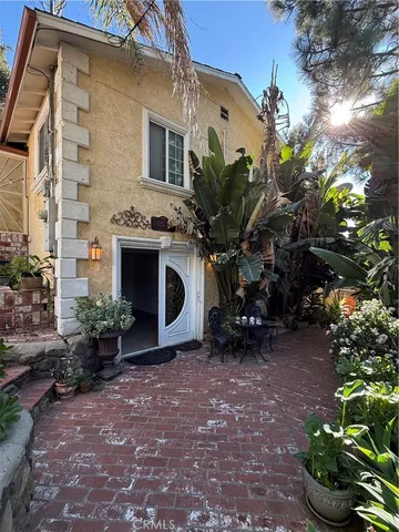 a view of a house with a yard and plants
