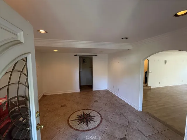 a view of a livingroom with furniture and a garage