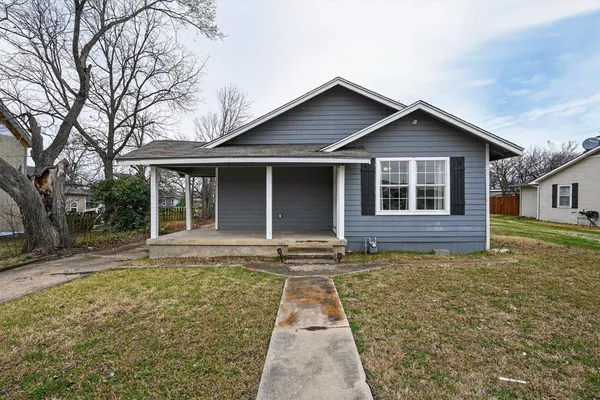 a front view of a house with yard