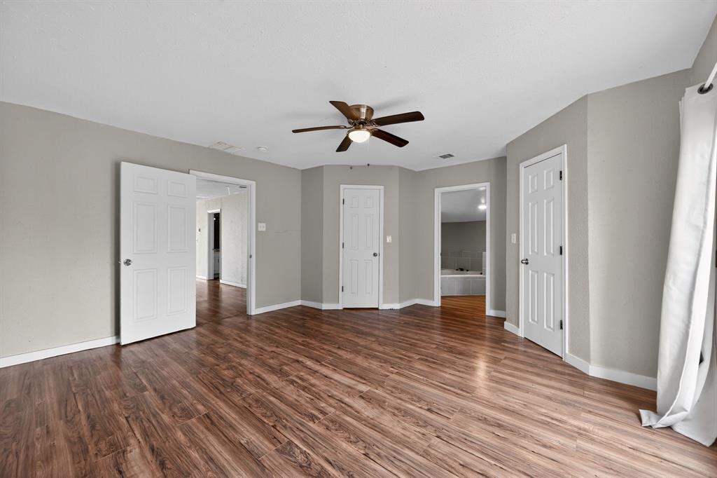 205 South Mable Street Ferris, TX 75125 - Photo 19 of 31 a view of an empty room with wooden floor