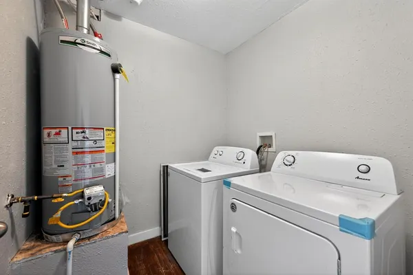 a view of bathroom with washer and dryer