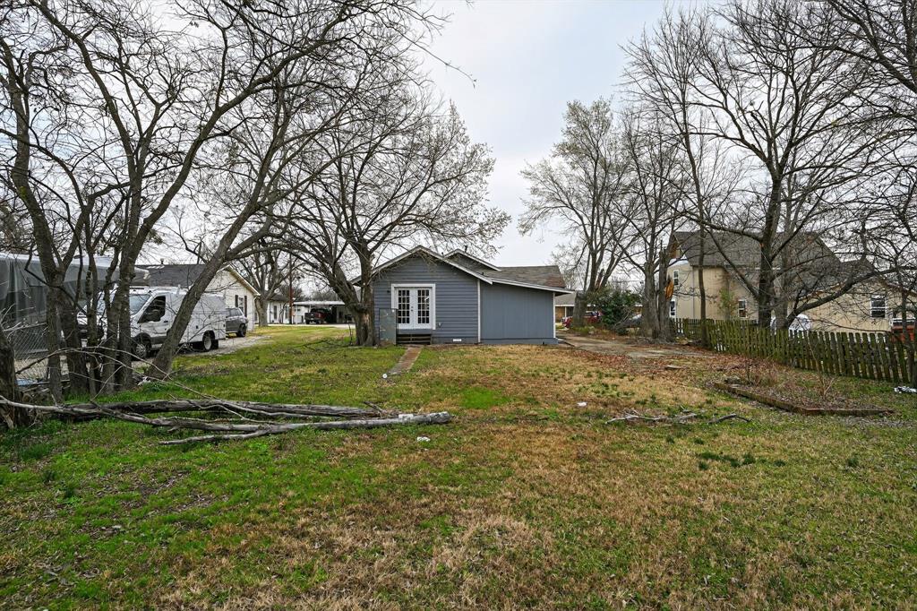 205 South Mable Street Ferris, TX 75125 - Photo 25 of 31 a view of house with backyard