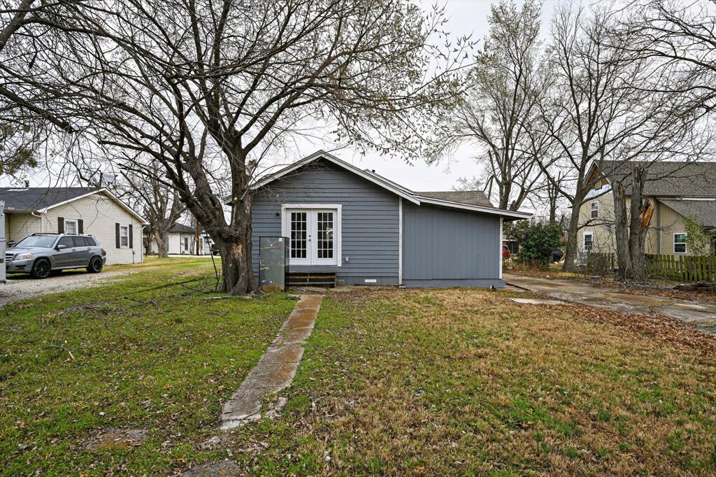 205 South Mable Street Ferris, TX 75125 - Photo 26 of 31 a view of house that has a yard