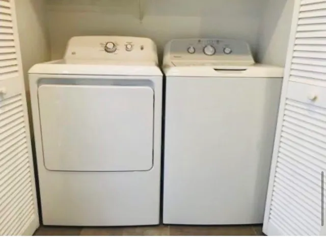 a utility room with dryer and washer