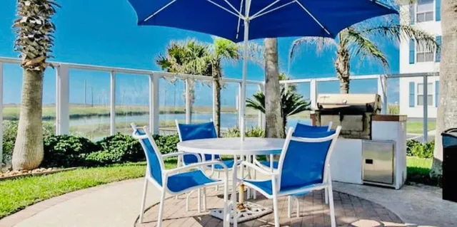 a view of an outdoor sitting area with swimming pool
