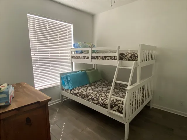a view of a workspace with furniture and window