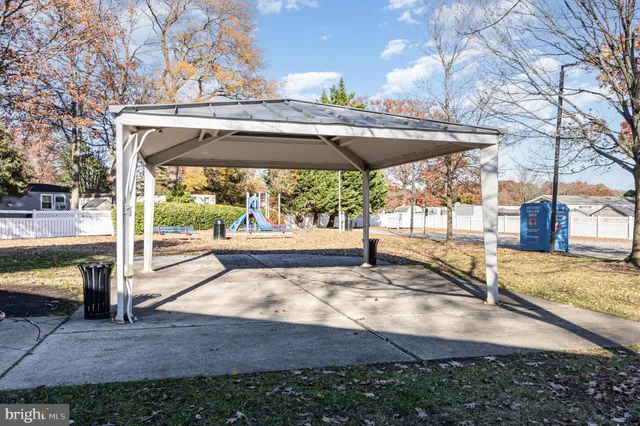a view of a room with gym equipment and windows