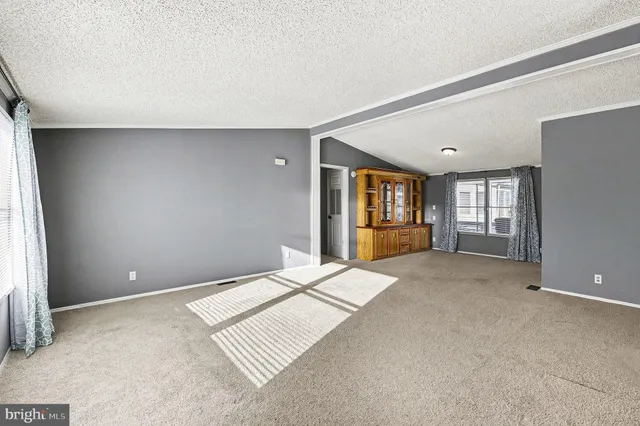 a big room with windows and closet