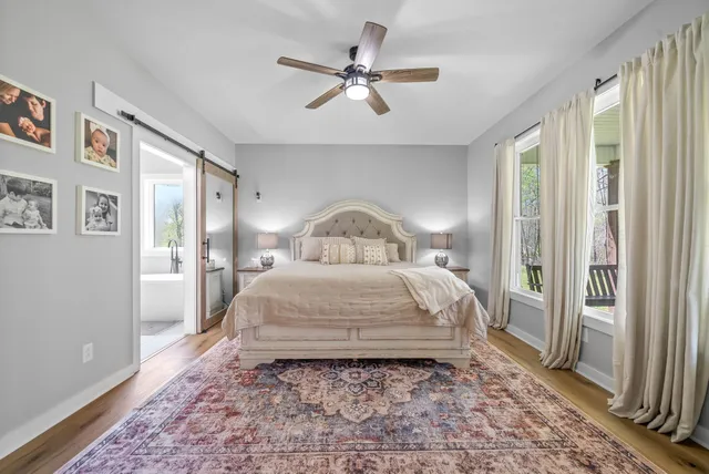 a bathroom with a granite countertop double vanity sink and a mirror