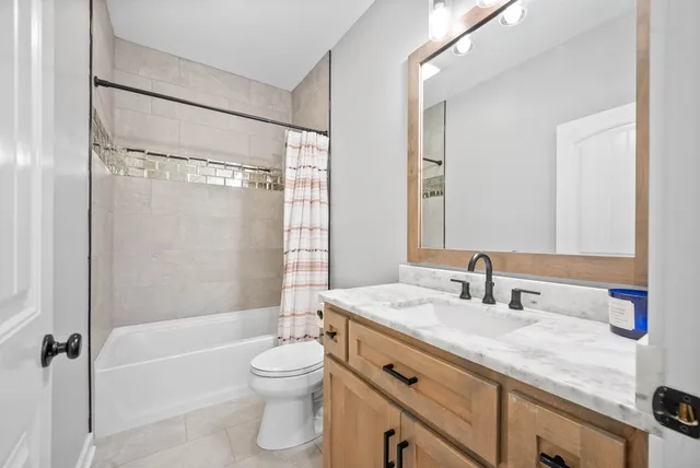 a bathroom with a sink a toilet and a bathtub