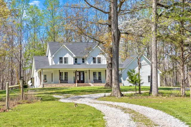 a view of a brick house with many windows