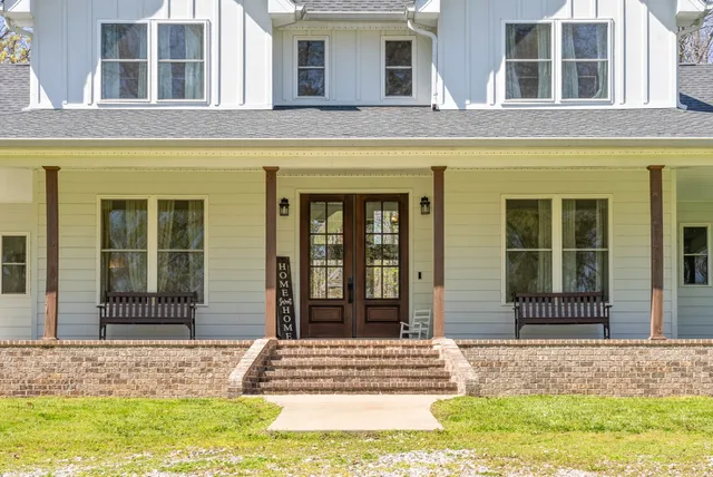 a view of a hallway view with wooden floor and staircase