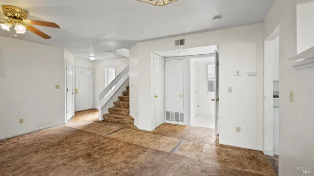 a view of a hallway view with staircase