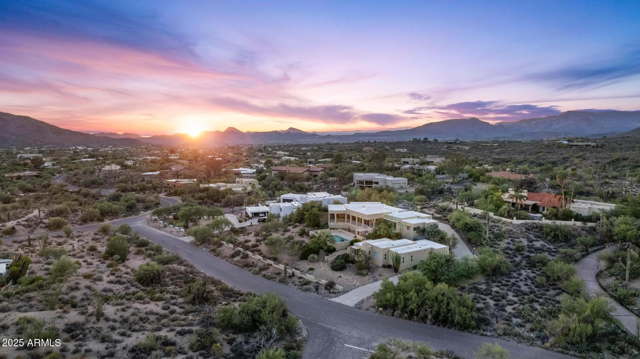 a view of a city with mountains in the background