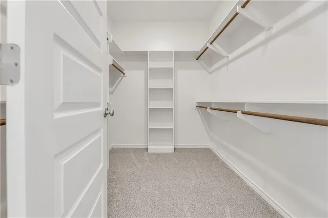 a view of an empty walk in closet