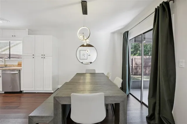 a view of dining area with chandelier