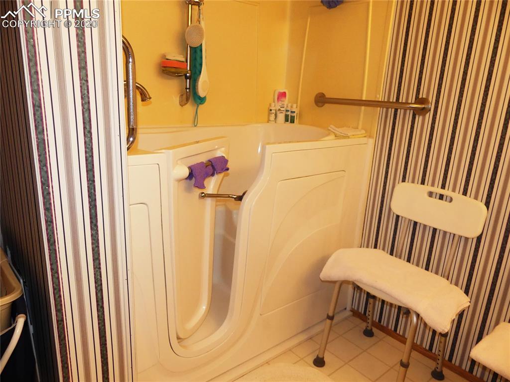 30150 Antioch Road Yoder, CO 80864 - Photo 17 of 36 Master Bath with walk-in tub/shower