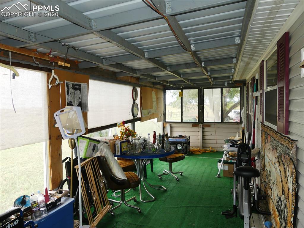 30150 Antioch Road Yoder, CO 80864 - Photo 18 of 36 Enclosed porch