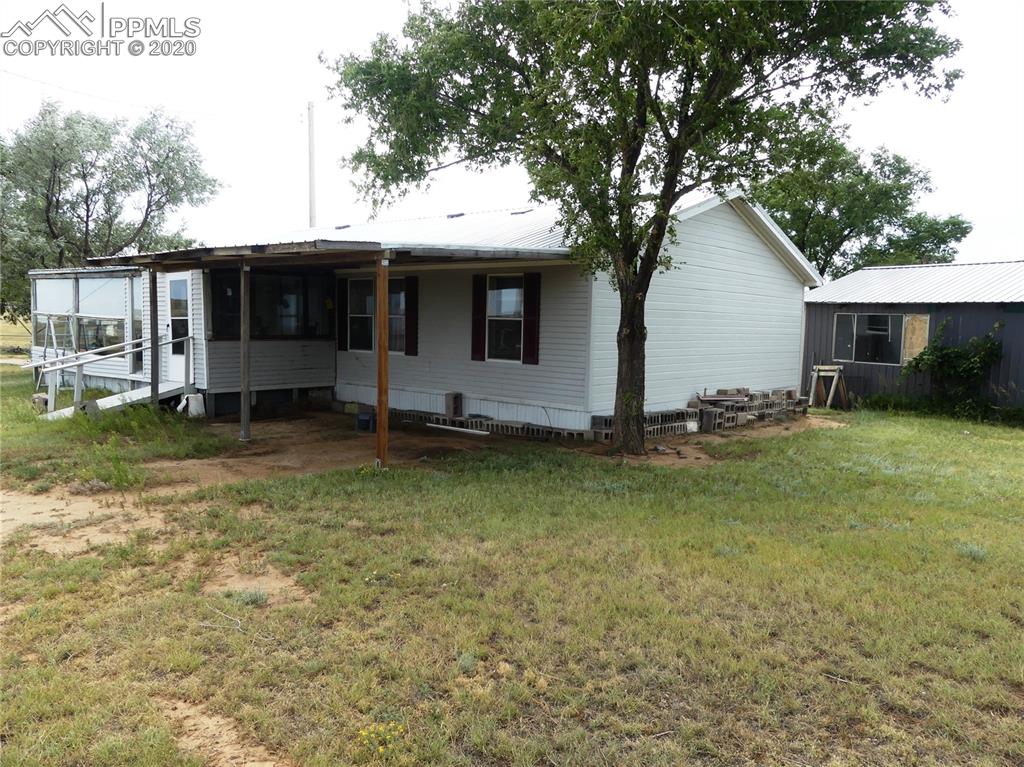 30150 Antioch Road Yoder, CO 80864 - Photo 4 of 36 Enclosed porch and carport
