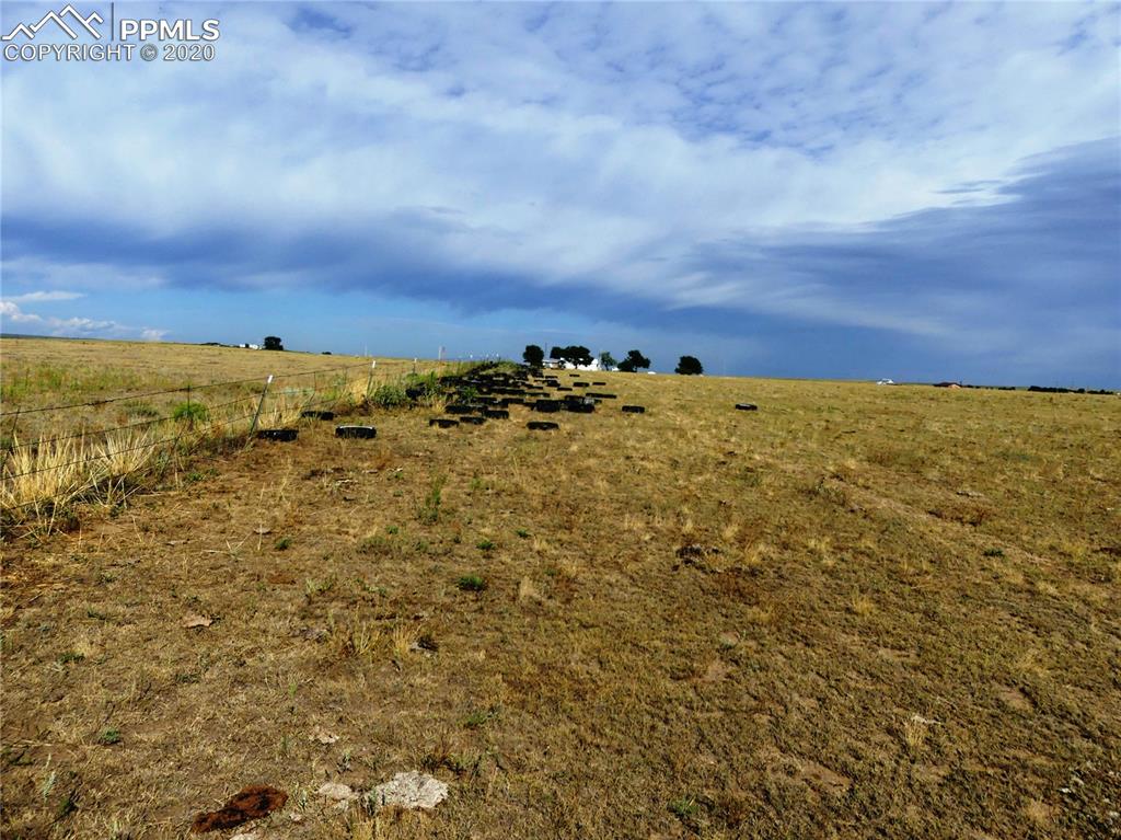 30150 Antioch Road Yoder, CO 80864 - Photo 35 of 36 Tire pile 3 in pasture west of stock shed