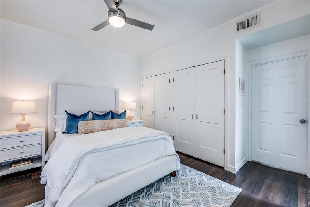 3315 Rosedale Avenue, Unit 4 University Park, TX 75205 - Photo 9 of 9 a bedroom with a bed and a chandelier
