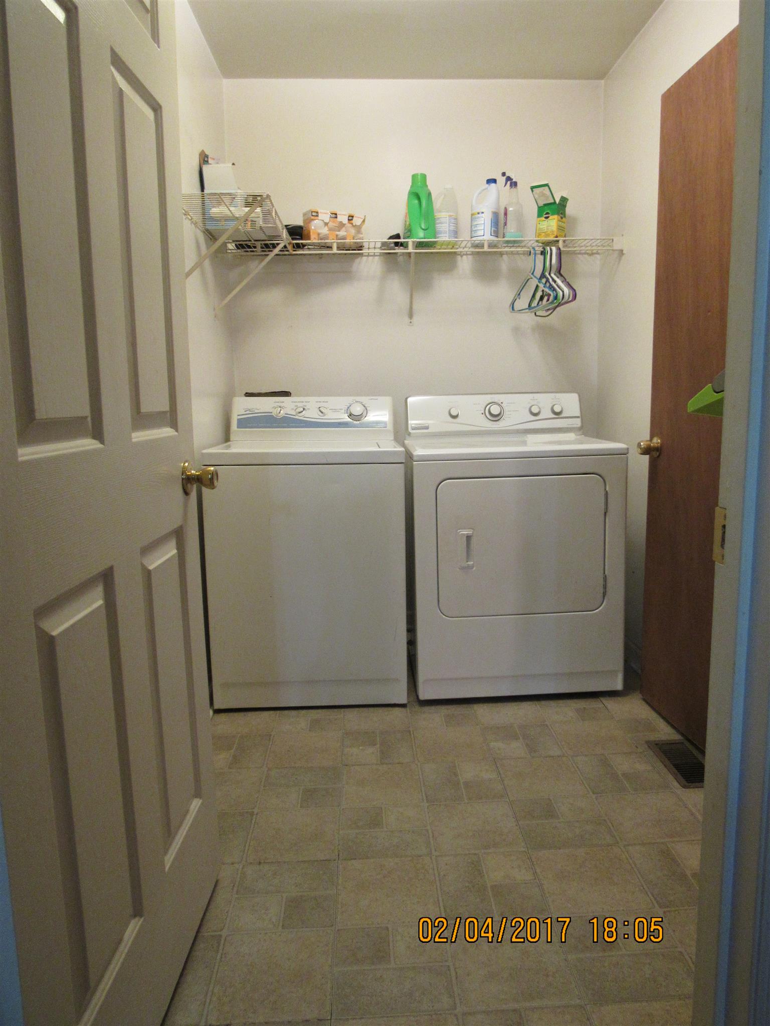 2324 South Mt Pleasant Road Greenbrier, TN 37073 - Photo 17 of 30 a utility room with cabinets and washer