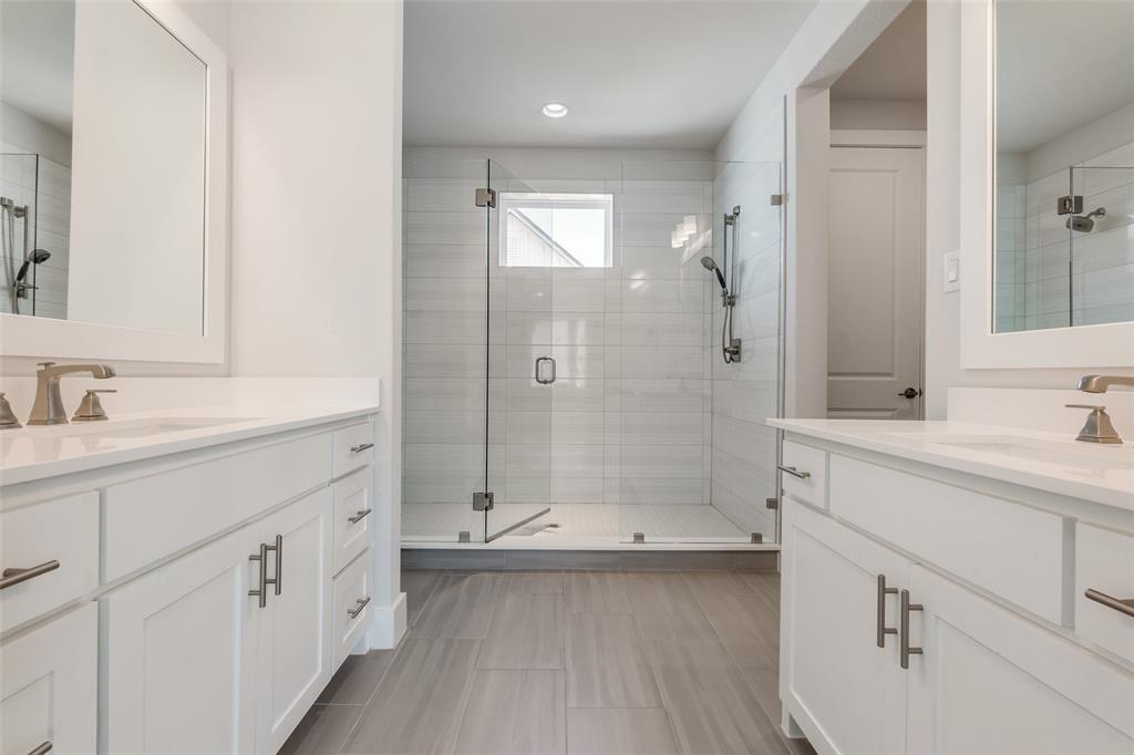 1119 Lavender Ridge Dallas, TX 75204 - Photo 12 of 24 Enjoy the space of this spacious primary escape covering the entire third floor of the home complete with double vanity, large walk in closet, and private balcony.