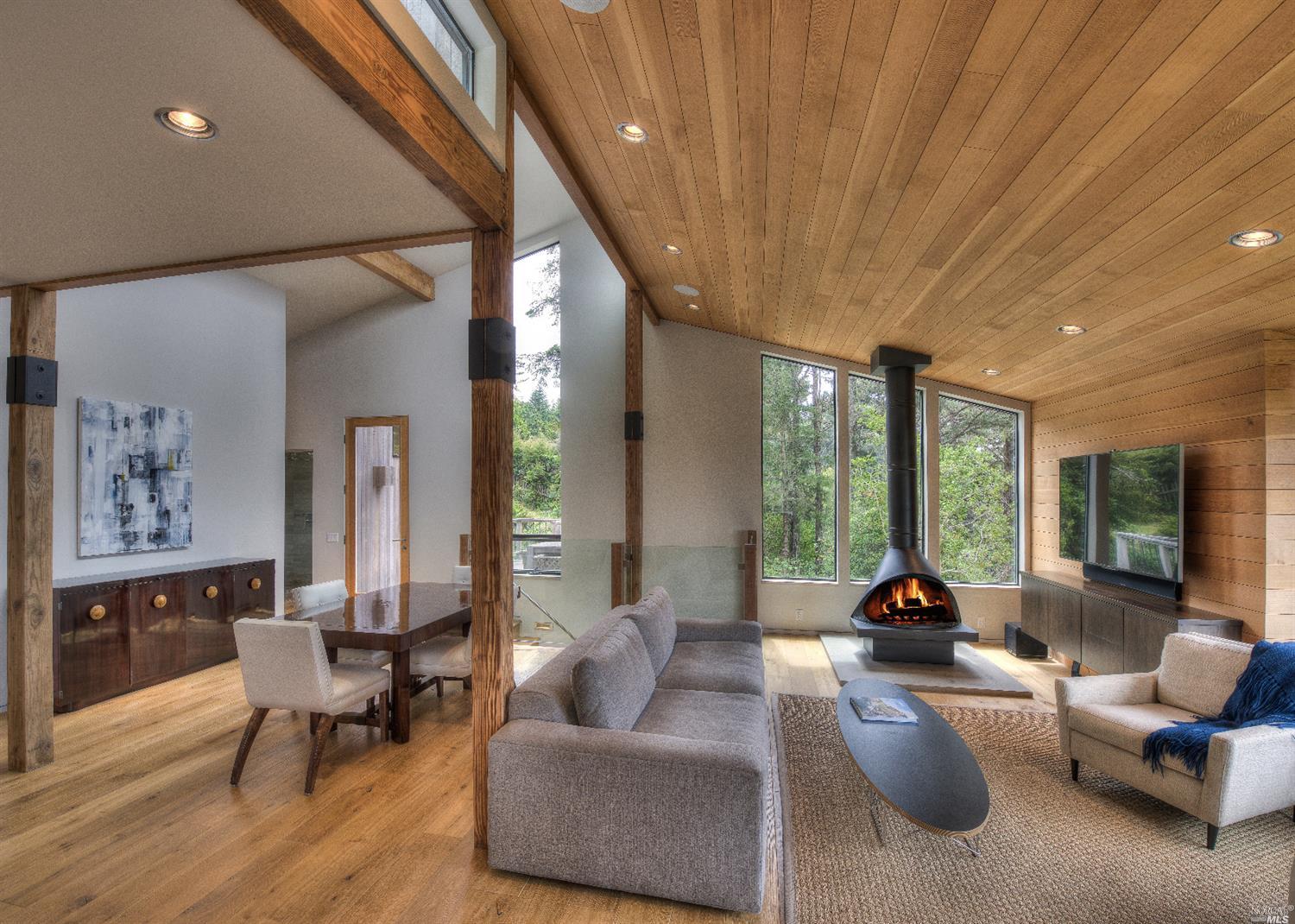 Great Room hosting gorgeous vertical grain fir wood finishes and hickory floors. Expansive architecturally integrated windows brings in light and view.