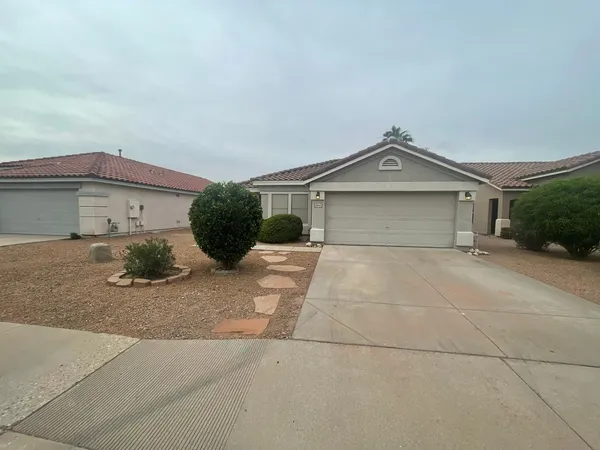 a front view of a house with garage