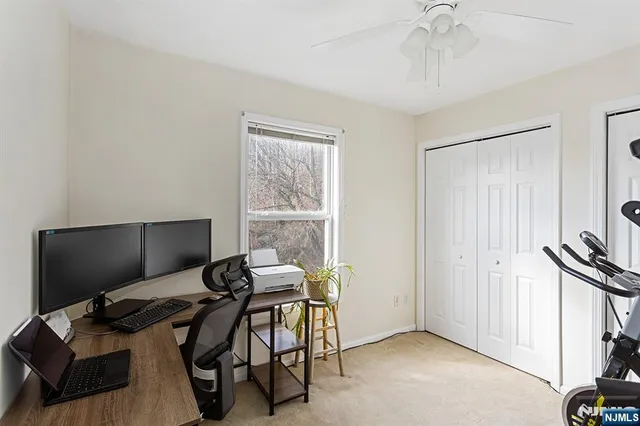 a view of a livingroom with furniture and a flat screen tv