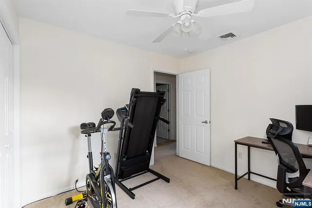 a view of workspace with furniture and windows