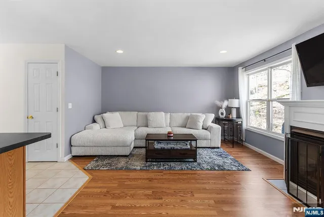 a living room with furniture window and a flat screen tv