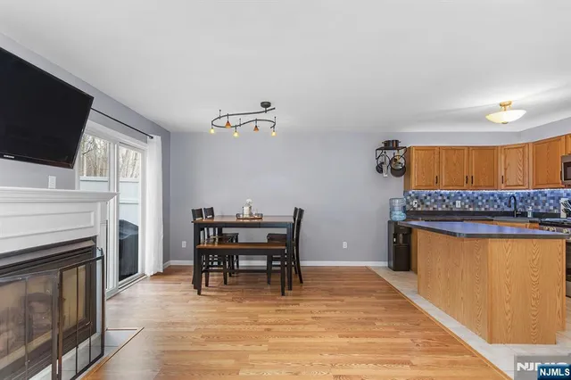a view of a kitchen with a sink and a fireplace