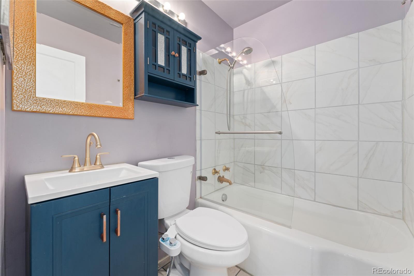 525 Jackson Street, Unit 304 Denver, CO 80206 - Photo 14 of 23 a bathroom with a sink a toilet and shower