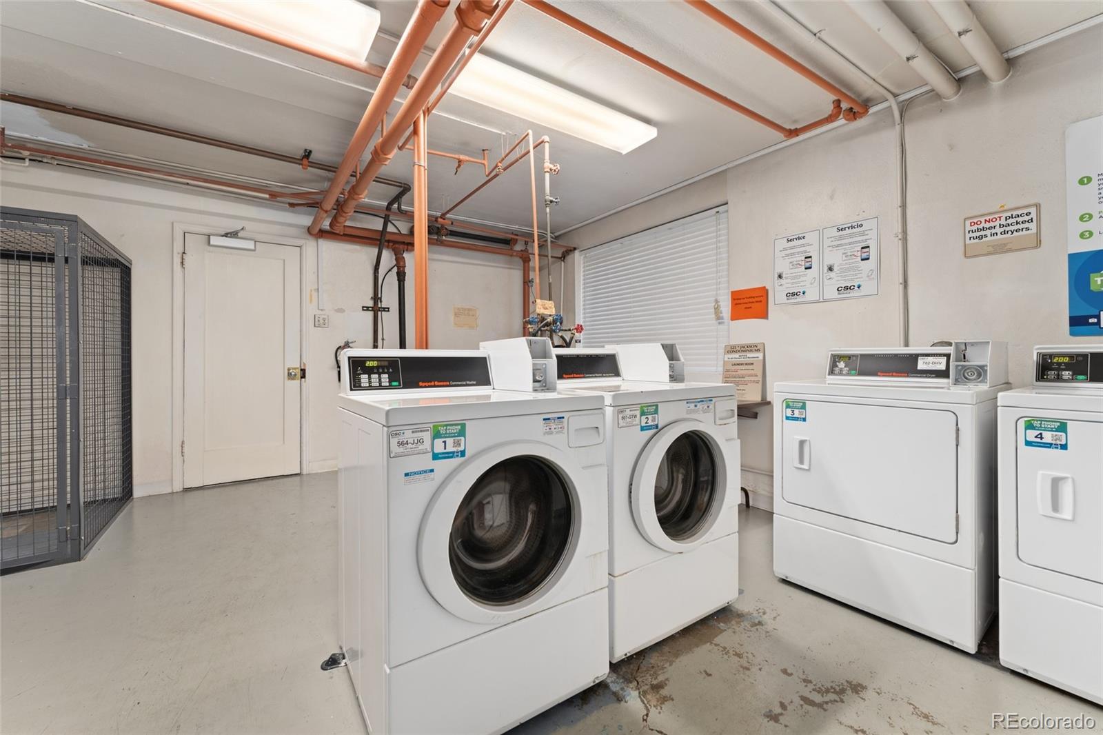 525 Jackson Street, Unit 304 Denver, CO 80206 - Photo 15 of 23 a utility room with dryer and washer