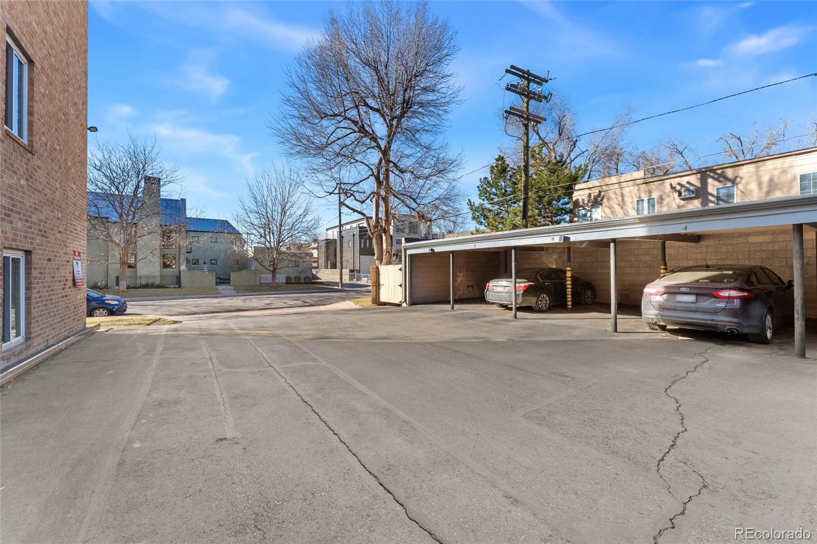 525 Jackson Street, Unit 304 Denver, CO 80206 - Photo 17 of 23 a view of a car parked in front of a building