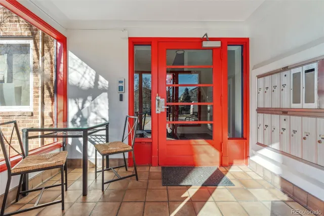 a view of living room kitchen and entryway