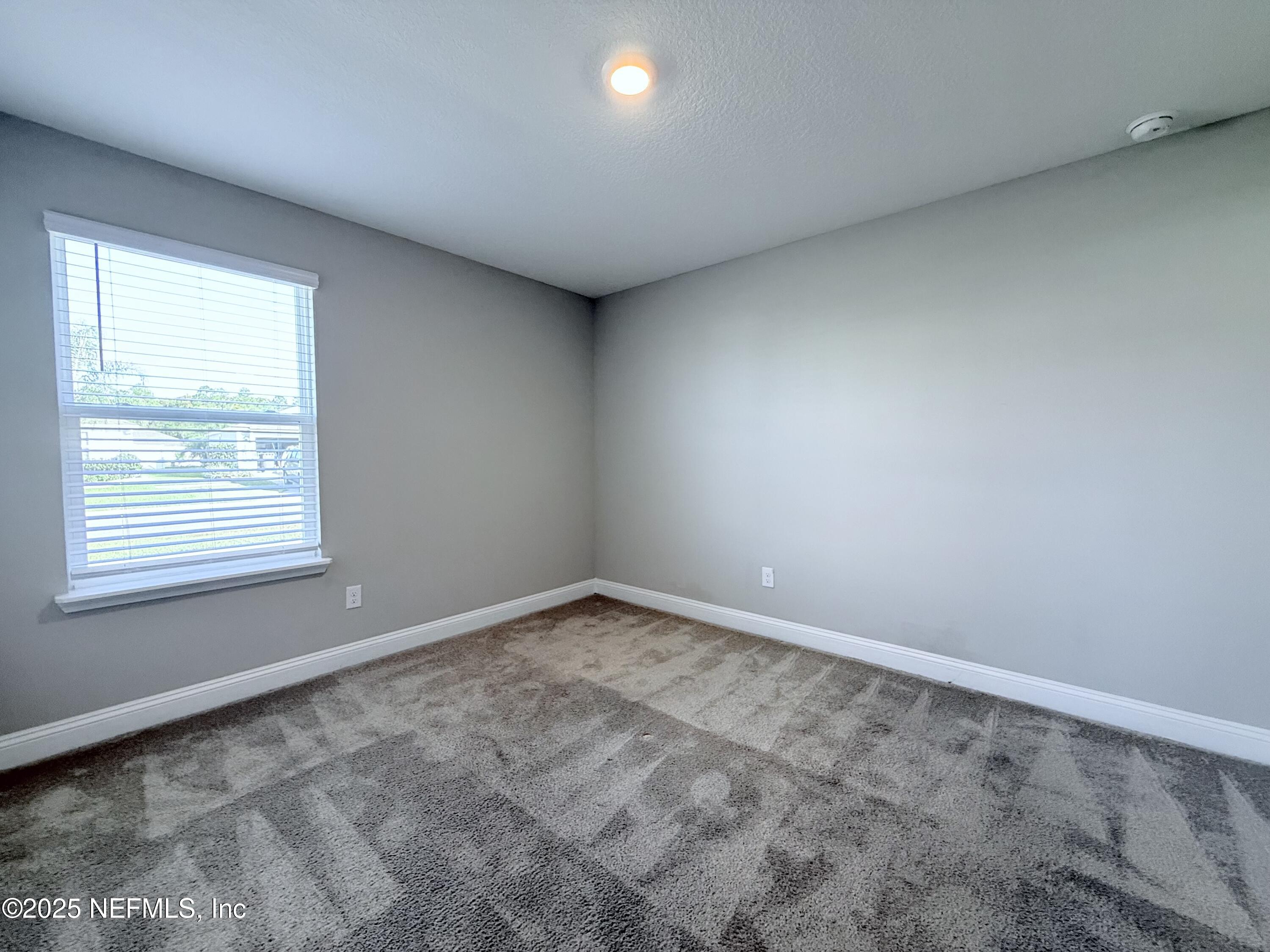 23 Alagon Way Street St. Augustine, FL 32084 - Photo 17 of 39 an empty room with a window