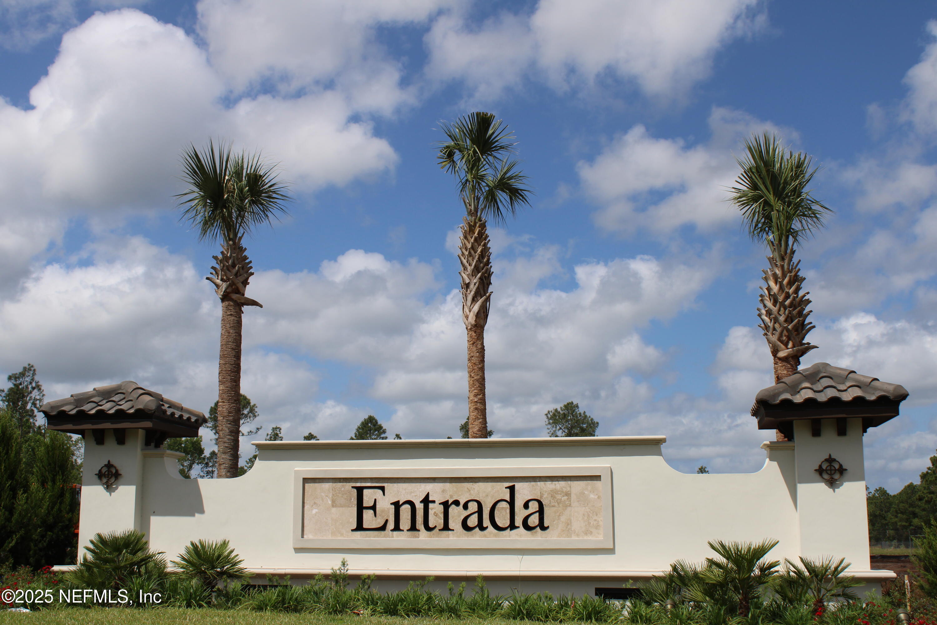 23 Alagon Way Street St. Augustine, FL 32084 - Photo 28 of 39 a close up of a sign board with potted plants