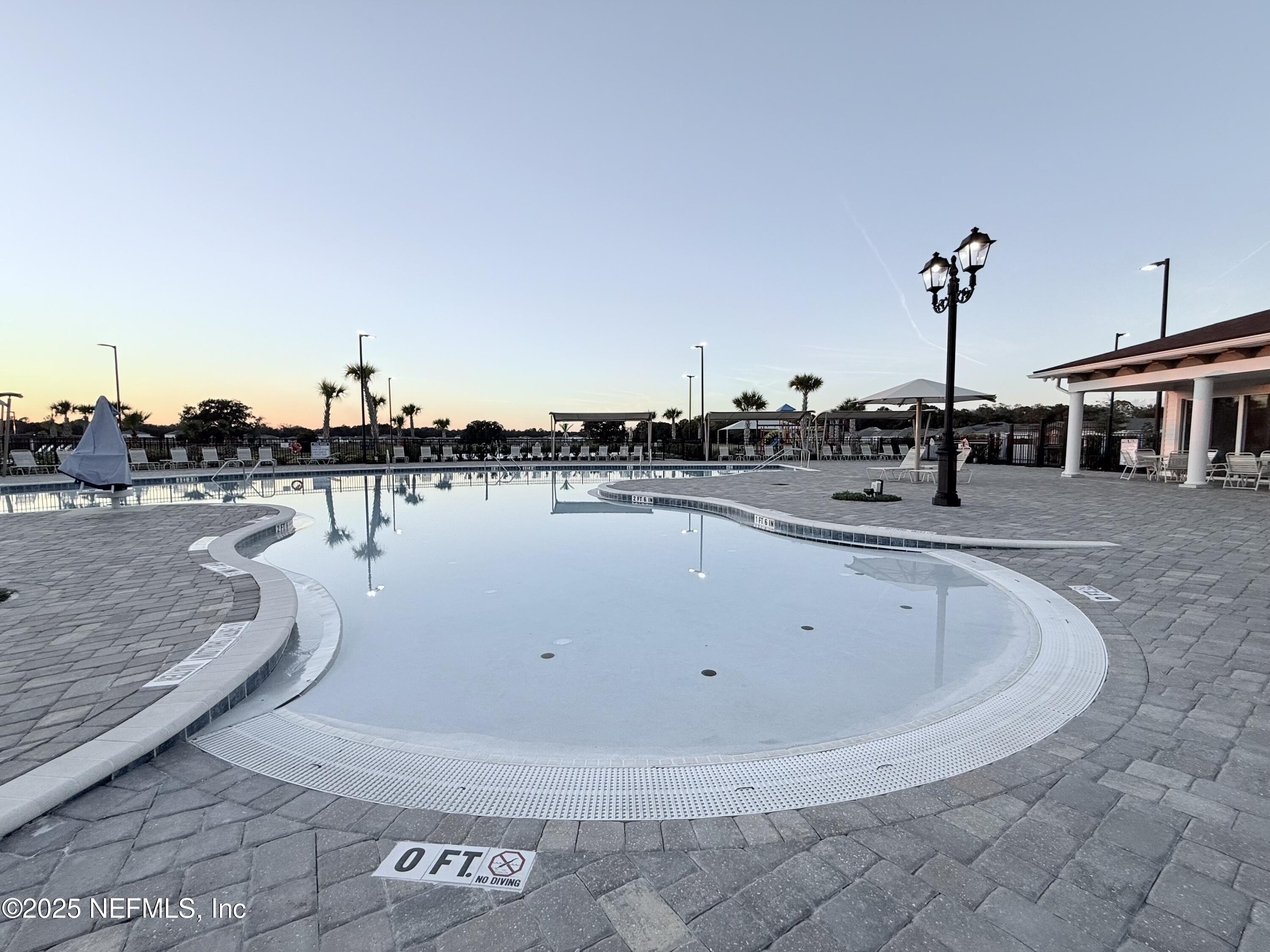 23 Alagon Way Street St. Augustine, FL 32084 - Photo 34 of 39 a view of a swimming pool with outdoor seating