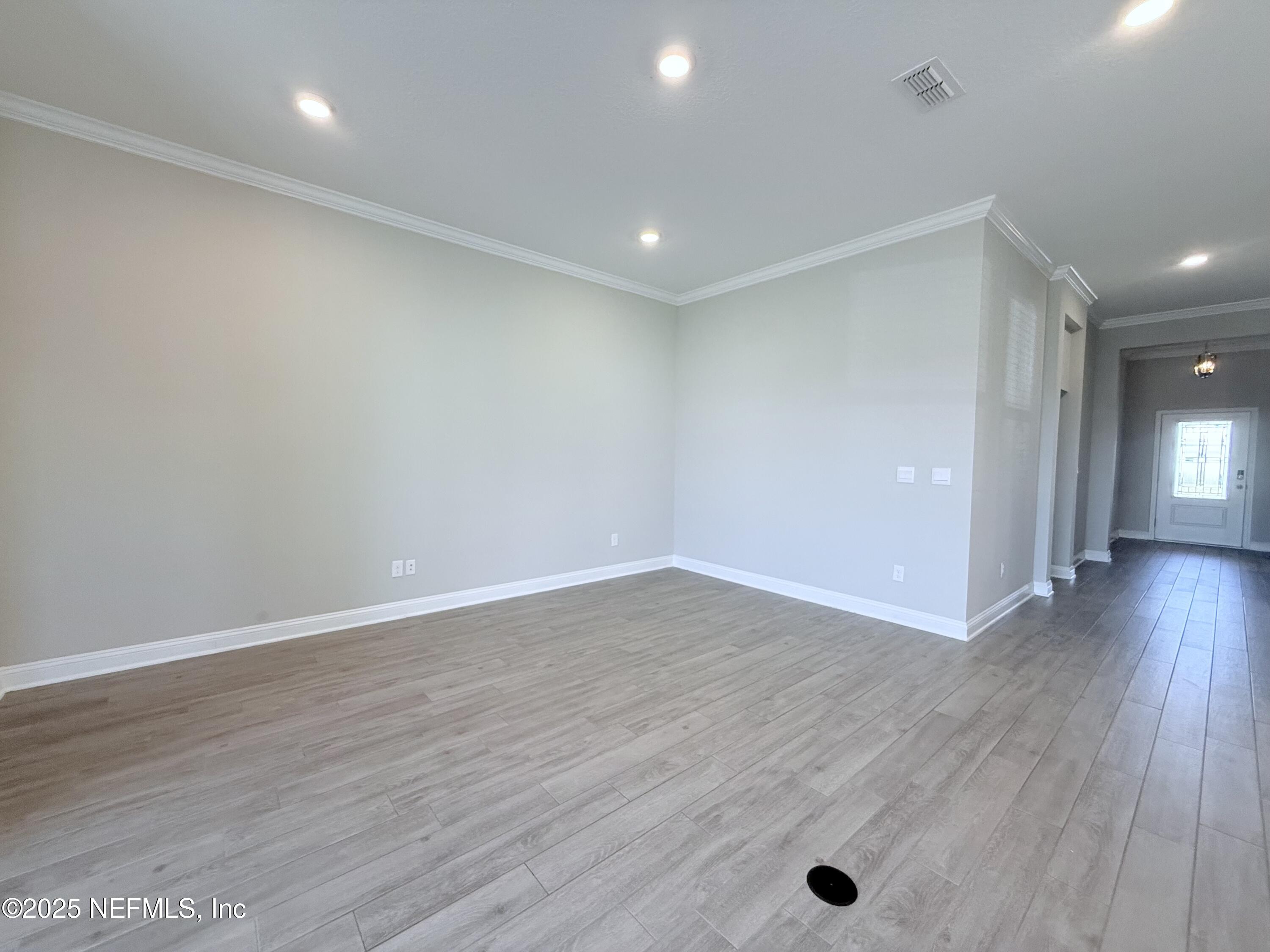 23 Alagon Way Street St. Augustine, FL 32084 - Photo 7 of 39 a view of a room with wooden floor