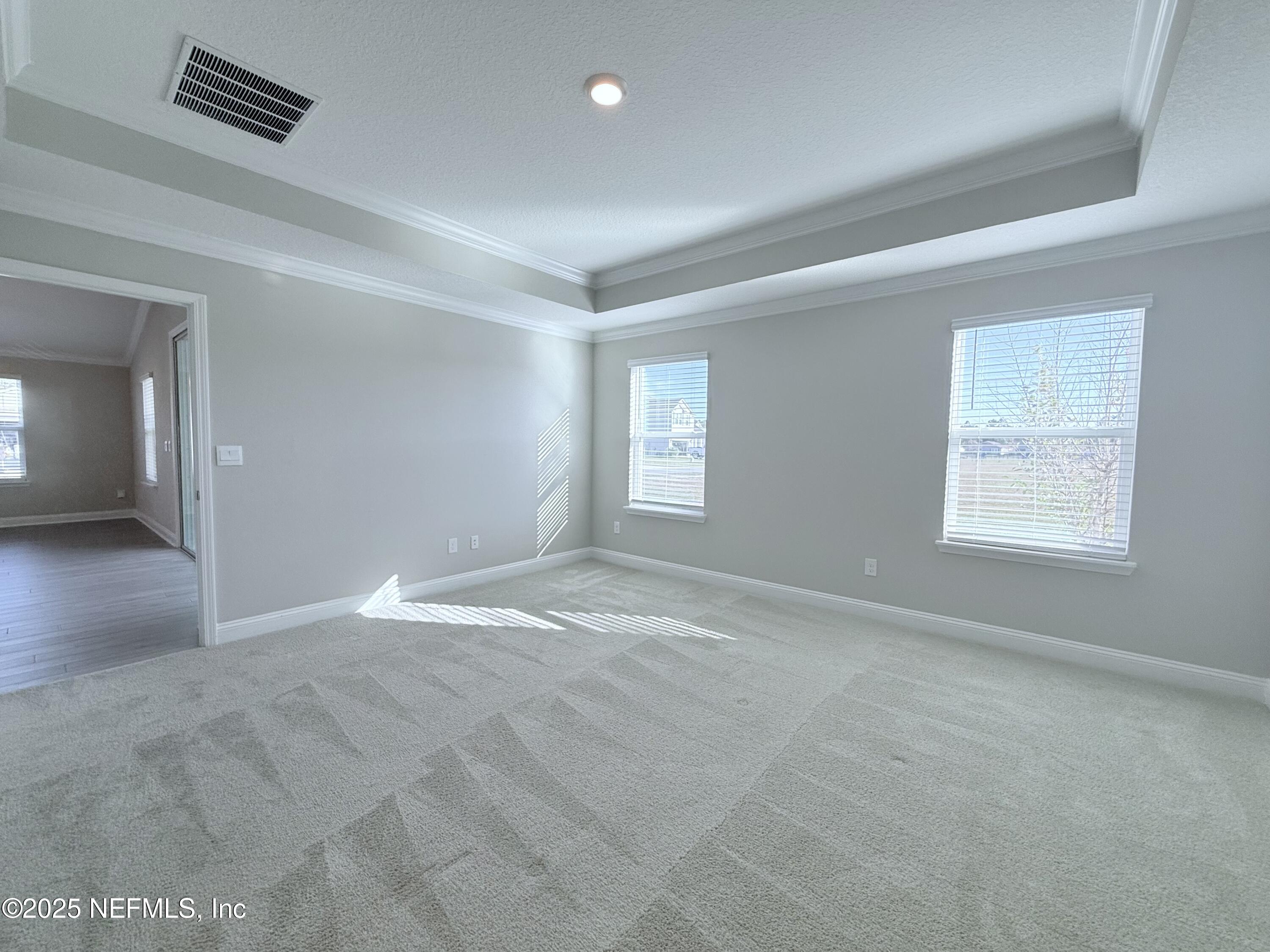 23 Alagon Way Street St. Augustine, FL 32084 - Photo 10 of 39 an empty room with windows and closet